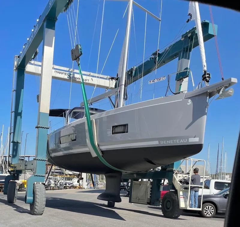 Slide: The Image of Beneteau Oceanis 46.1 sailboat being lifted by a marine travel lift, 2022 model. - 10