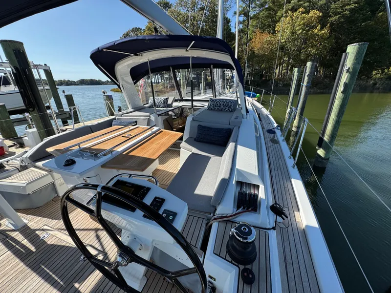 Slide: The Image of Beneteau Oceanis 46.1 yacht, 2022 model, docked with spacious deck and seating area. - 15