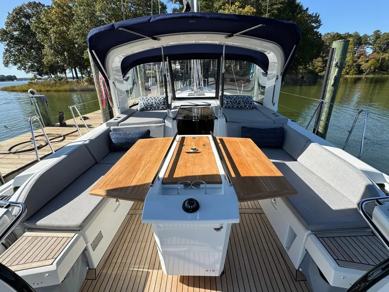 Slide: The Image of Beneteau Oceanis 46.1 yacht interior, 2022 model, featuring spacious seating and wooden table. - 16