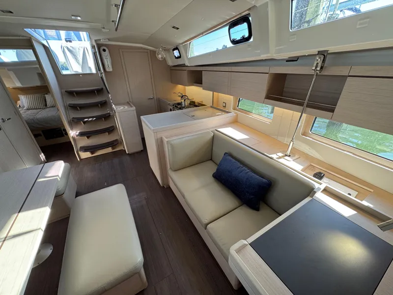 Slide: The Image of Luxurious interior of 2022 Beneteau Oceanis 46.1 yacht with modern furnishings and ample natural light. - 26
