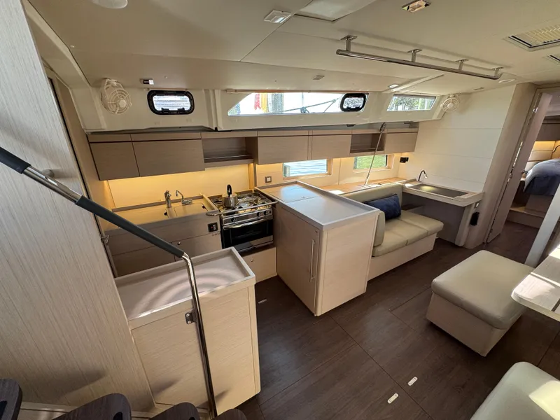 Slide: The Image of Luxurious interior of 2022 Beneteau Oceanis 46.1 yacht with modern kitchen and seating area. - 27