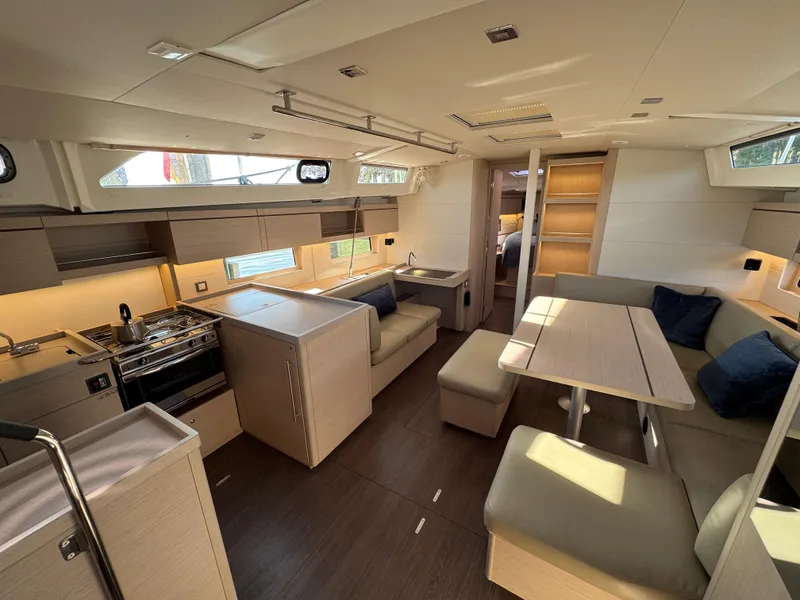 Slide: The Image of Luxurious interior of 2022 Beneteau Oceanis 46.1 yacht with modern kitchen and seating area. - 28