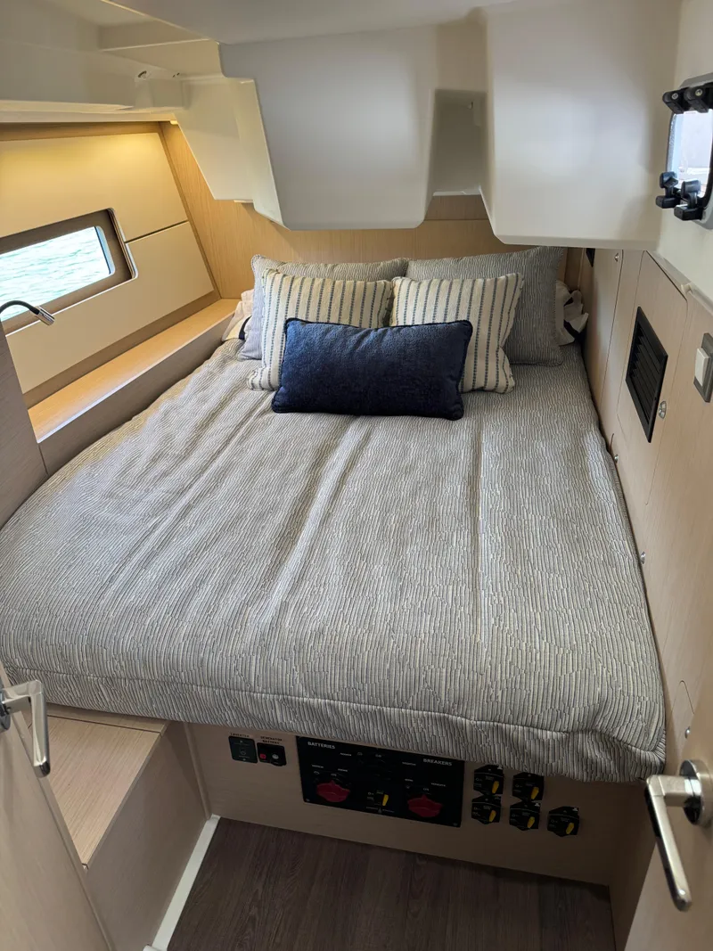 Slide: The Image of Cozy cabin interior of 2022 Beneteau Oceanis 46.1 yacht with comfortable bedding. - 31