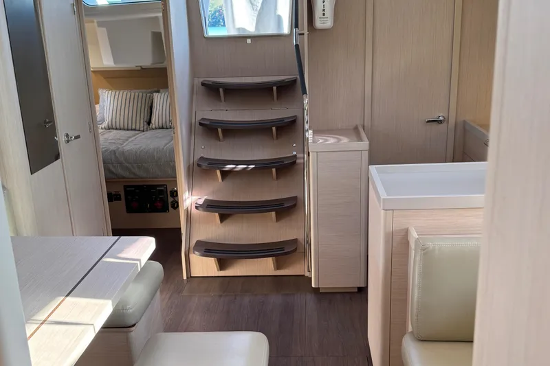 Slide: The Image of Interior of 2022 Beneteau Oceanis 46.1 yacht, featuring modern design and cozy cabin space. - 33