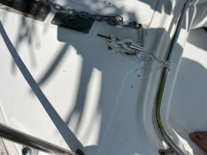 Slide: The Image of Close-up of 2004 Boston Whaler 240 Outrage deck with rope and chain. - 11