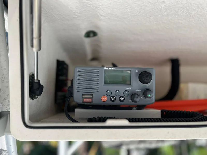 Slide: The Image of Raymarine marine radio on 2004 Boston Whaler 240 Outrage boat dashboard. - 18