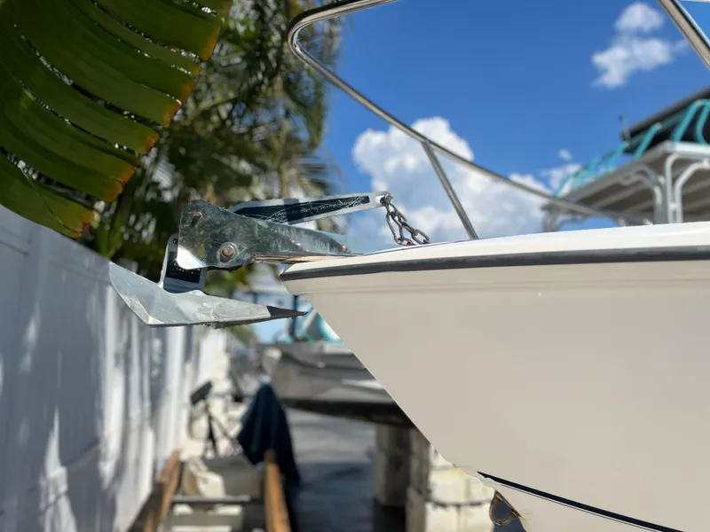 Slide: The Image of Close-up of 2004 Boston Whaler 240 Outrage boat anchor under a clear blue sky. - 30