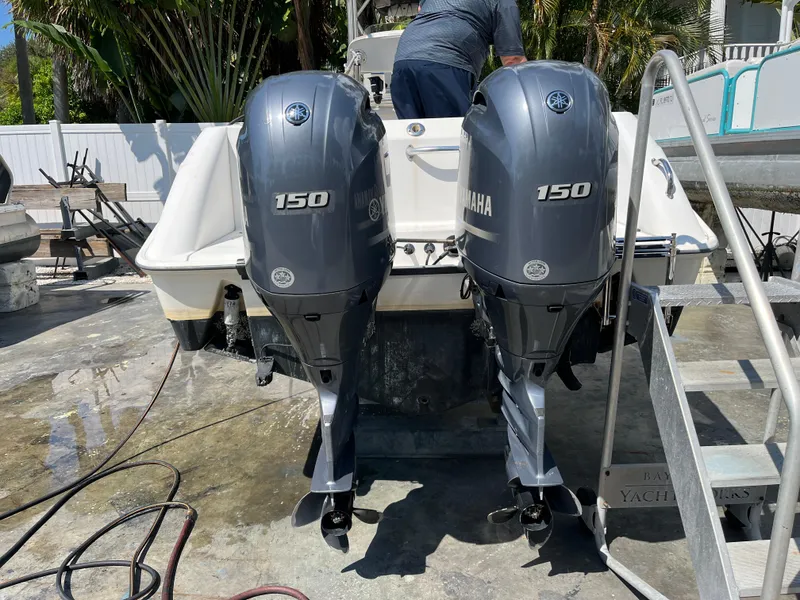 Slide: The Image of 2004 Boston Whaler 240 Outrage with twin Yamaha 150 outboard engines. - 32