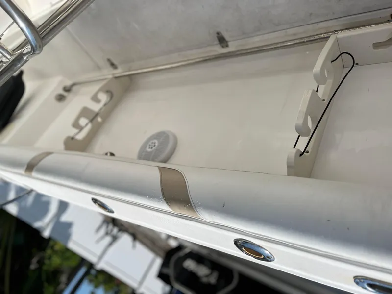Slide: The Image of Boston Whaler 240 Outrage 2004 boat interior detail with storage compartment. - 33