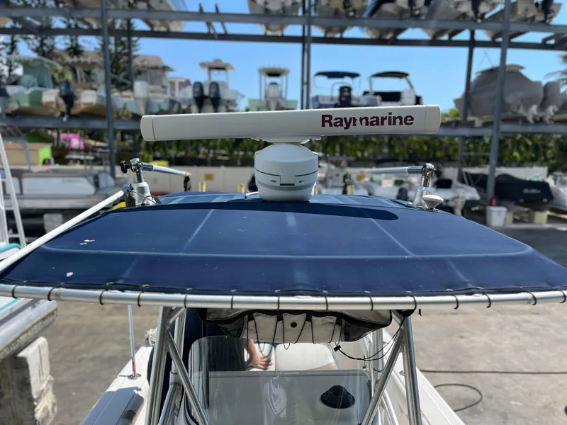 Slide: The Image of Boston Whaler 240 Outrage 2004 with Raymarine radar, docked in a marina. - 40