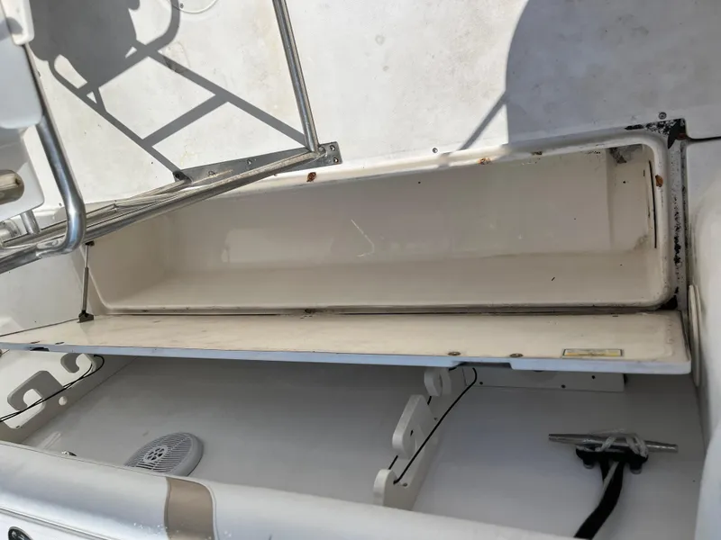 Slide: The Image of Open storage compartment on a 2004 Boston Whaler 240 Outrage boat. - 42