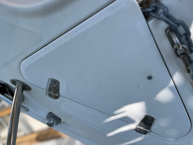 Slide: The Image of Close-up of 2004 Boston Whaler 240 Outrage boat deck with metal fixtures and chain. - 44