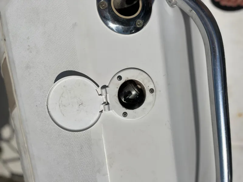 Slide: The Image of Fuel cap on a 2004 Boston Whaler 240 Outrage boat deck. - 46