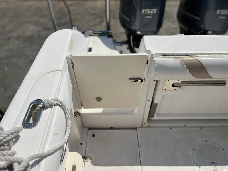 Slide: The Image of 2004 Boston Whaler 240 Outrage boat interior with dual 150 engines. - 47