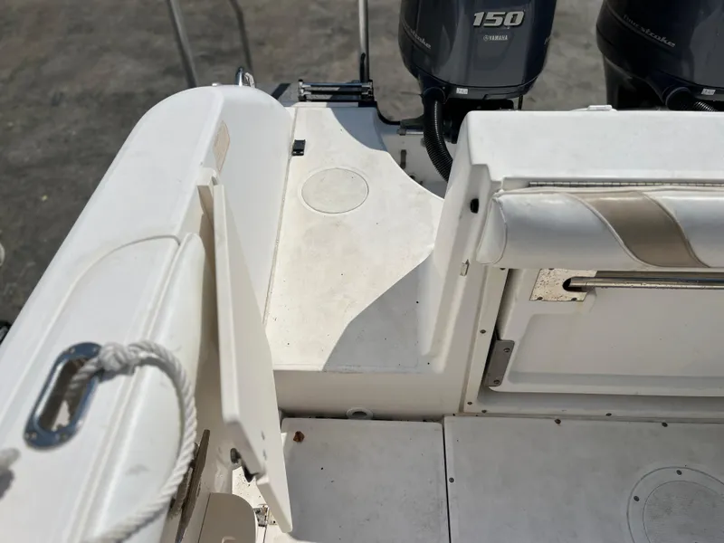 Slide: The Image of Boston Whaler 240 Outrage 2004 boat deck with Yamaha 150 engines. - 48