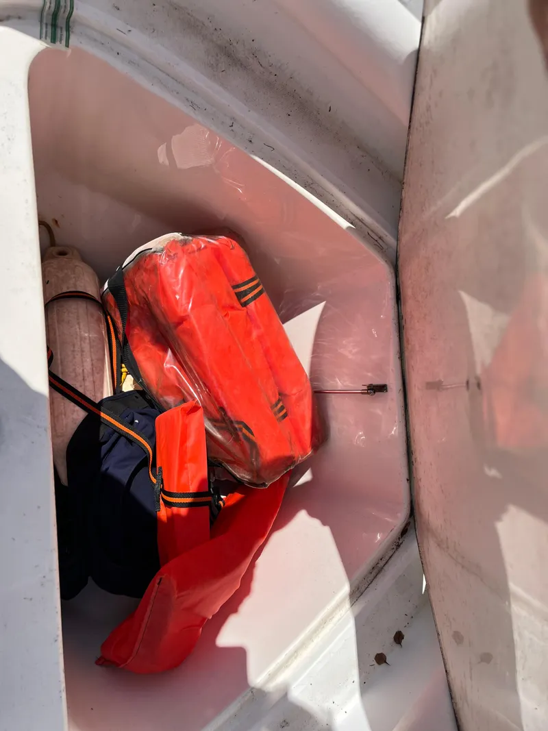 Slide: The Image of Storage compartment of 2004 Boston Whaler 240 Outrage with safety gear. - 49