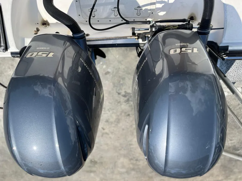 Slide: The Image of Twin Yamaha 150 outboard engines on a 2004 Boston Whaler 240 Outrage boat. - 8
