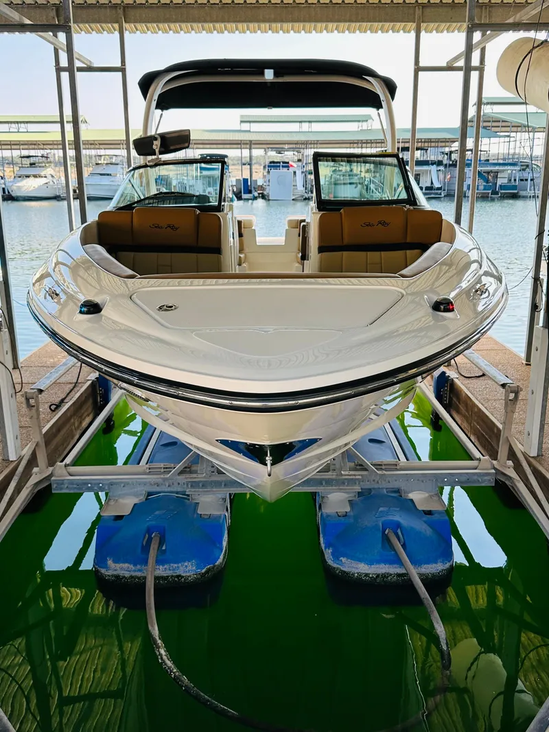 Slide: The Image of 2015 Sea Ray 250 SLX boat docked in marina, front view. - 12