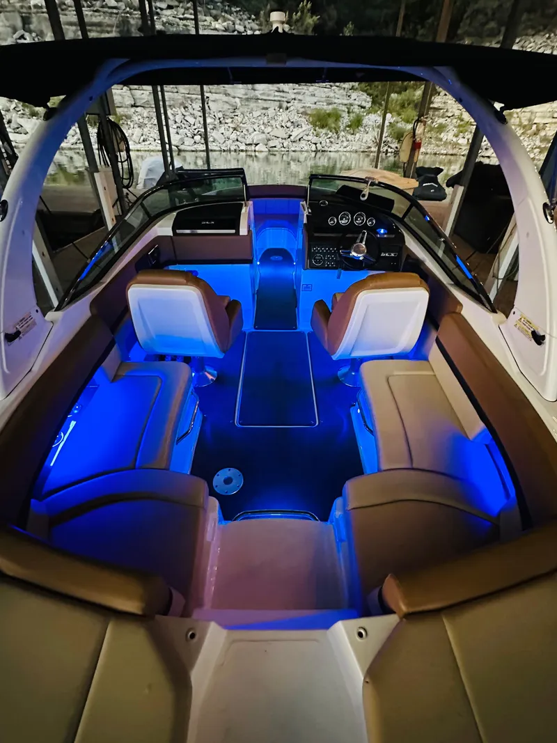 Slide: The Image of 2015 Sea Ray 250 SLX boat interior with blue LED lighting. - 17