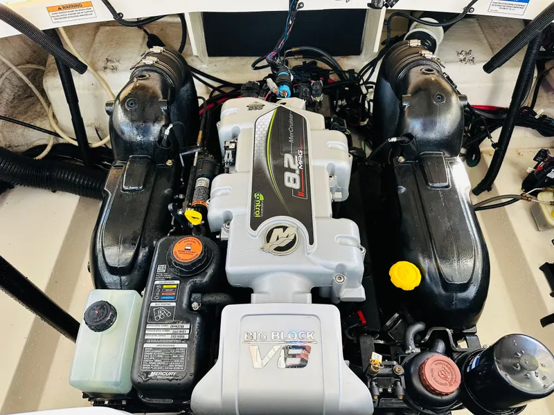 Slide: The Image of 2015 Sea Ray 250 SLX engine compartment with 8.2L V8 engine. - 18