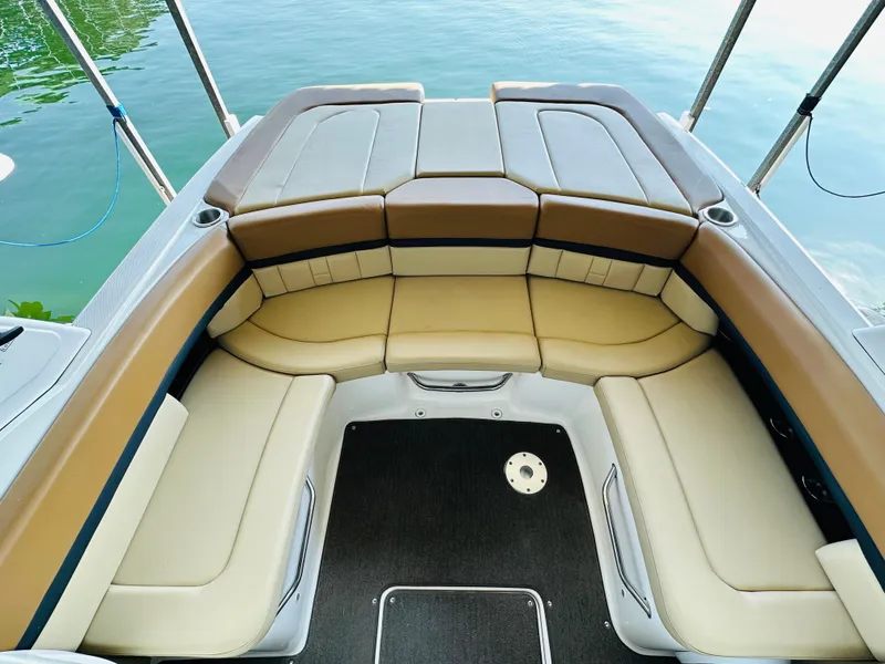 Slide: The Image of Luxurious seating on 2015 Sea Ray 250 SLX boat, overlooking serene water. - 29