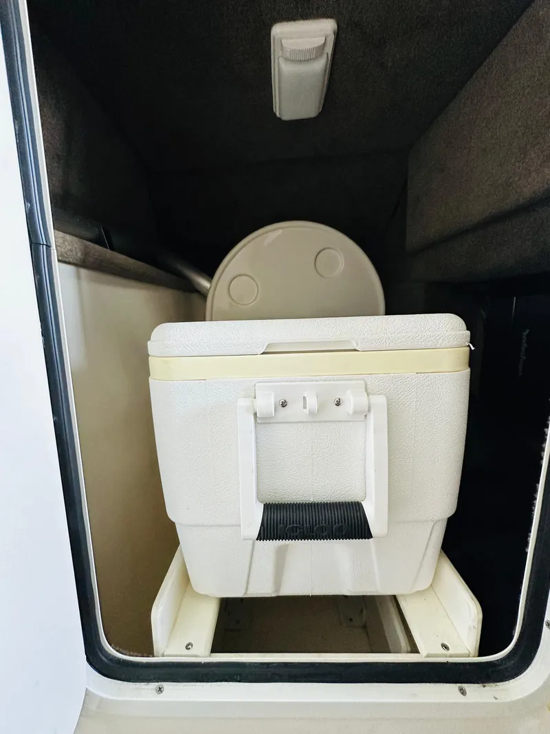 Slide: The Image of 2015 Sea Ray 250 SLX boat storage compartment with cooler. - 41