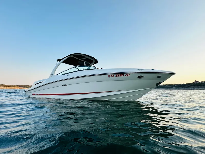 Slide: The Image of 2015 Sea Ray 250 SLX boat on calm water at sunset. - 5