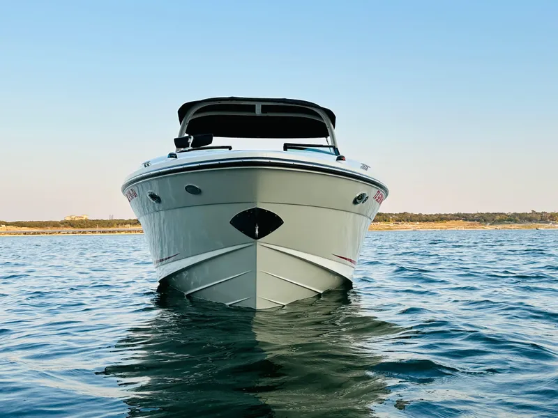 Slide: The Image of 2015 Sea Ray 250 SLX boat on calm water, front view. - 7