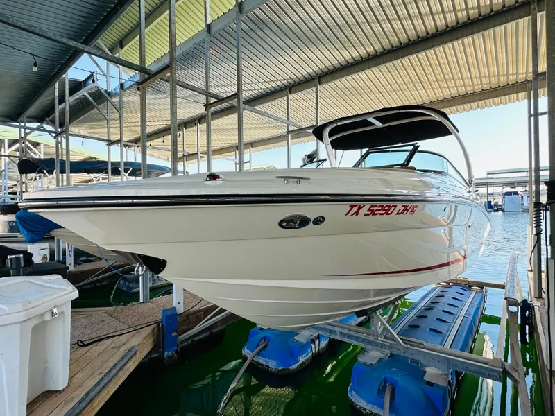 Slide: The Image of 2015 Sea Ray 250 SLX boat docked in marina, side view. - 9