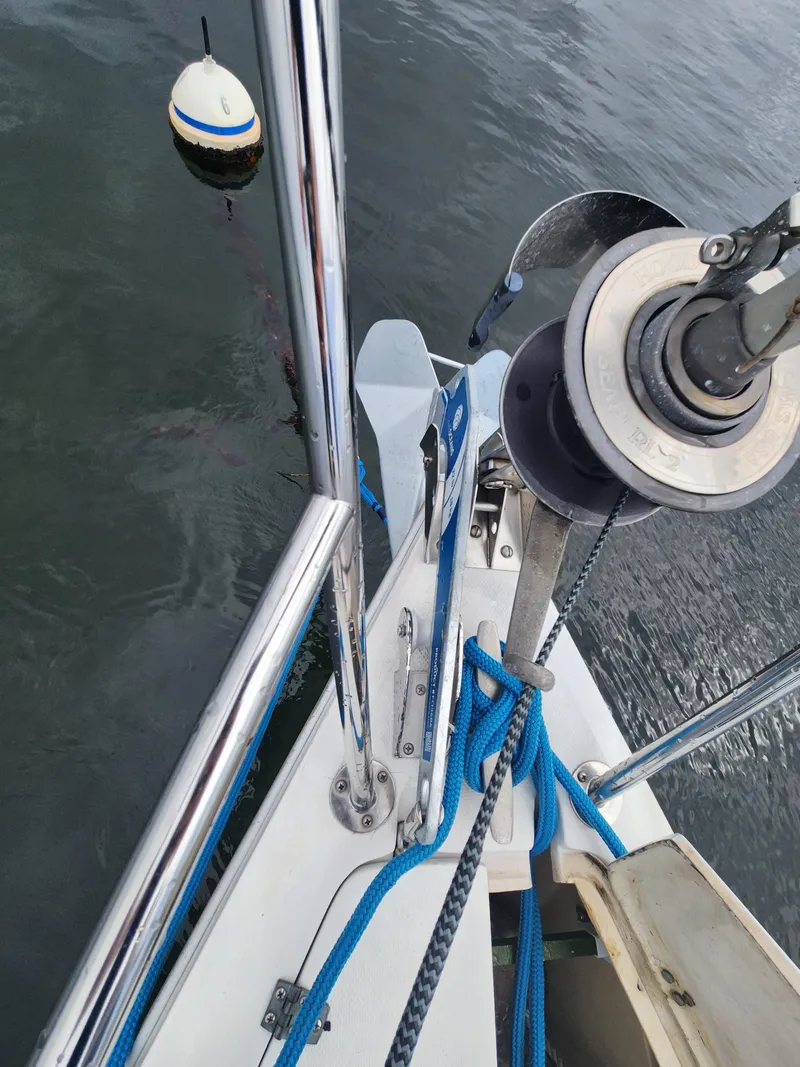 Slide: The Image of Bow of 1987 Catalina 36 sailboat with anchor and mooring buoy. - 11