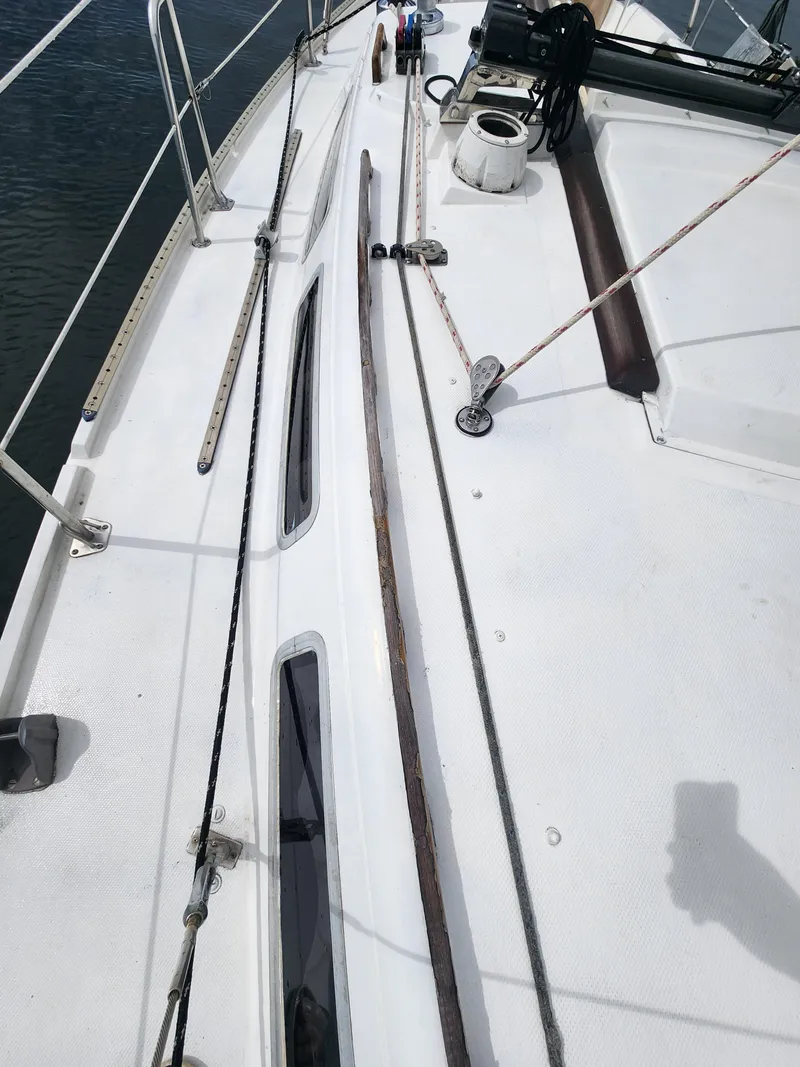 Slide: The Image of 1987 Catalina 36 sailboat deck with rigging and equipment visible. - 12
