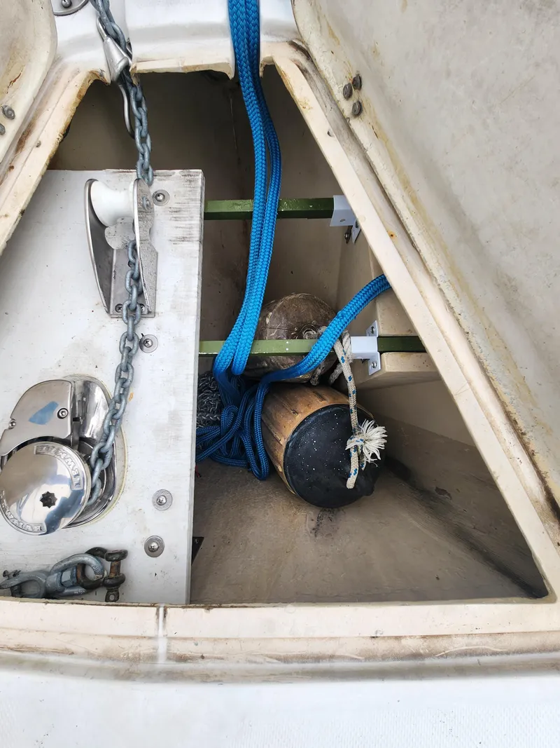 Slide: The Image of Anchor locker of a 1987 Catalina 36 sailboat with chain and blue rope. - 8