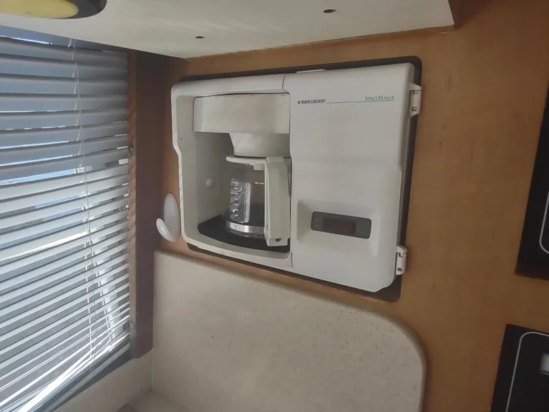 Slide: The Image of Built-in coffee maker in 2004 Mainship 400 Trawler kitchen area. - 20