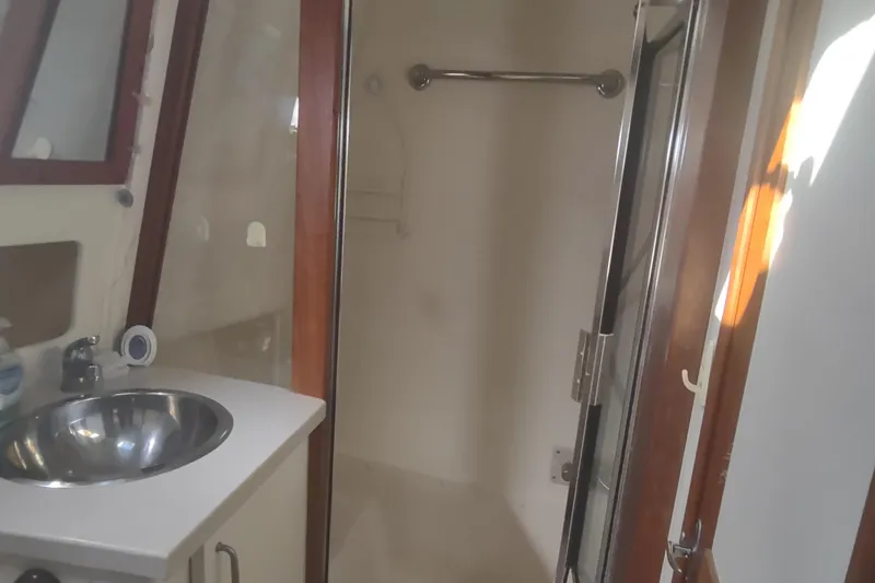 Slide: The Image of 2004 Mainship 400 Trawler bathroom with sink and shower. - 30