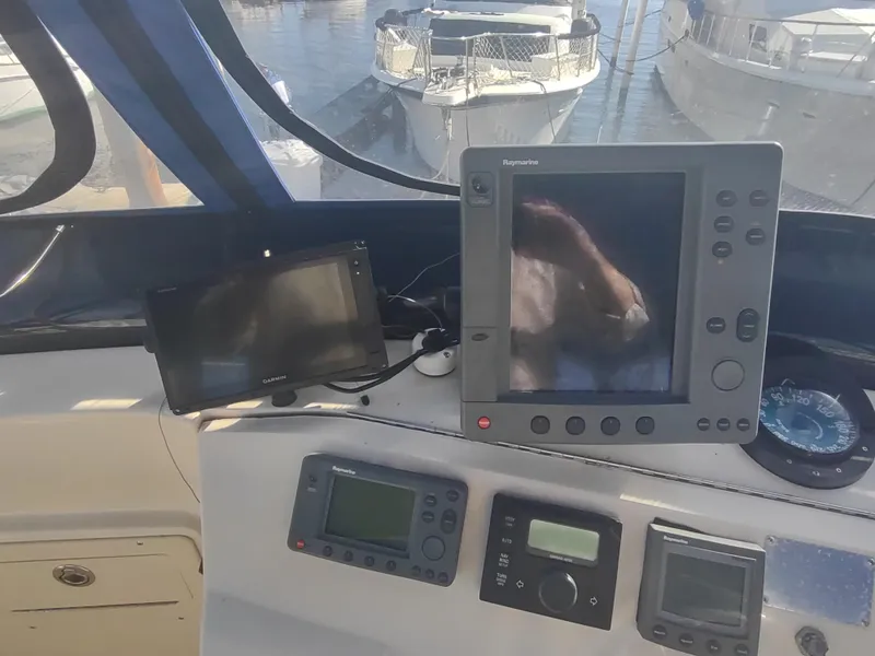 Slide: The Image of Mainship 400 Trawler 2004 helm with navigation equipment and controls. - 47