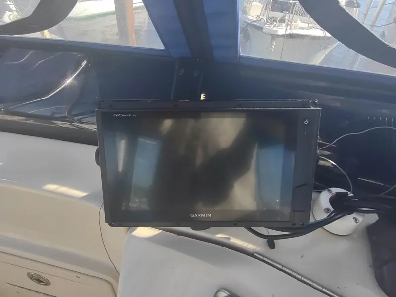 Slide: The Image of Garmin GPS on 2004 Mainship 400 Trawler dashboard, marine navigation equipment. - 48