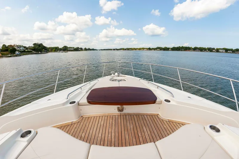 Slide: The Image of 2015 Sea Ray L659 Fly yacht deck with scenic water view. - 13