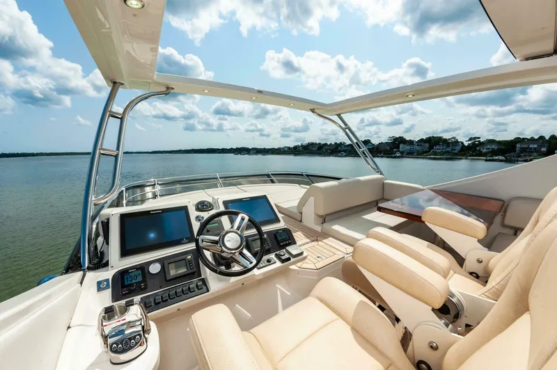 Slide: The Image of Luxurious 2015 Sea Ray L659 Fly yacht cockpit with scenic water view. - 16