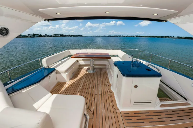 Slide: The Image of Luxurious 2015 Sea Ray L659 Fly yacht with spacious deck and scenic water view. - 20