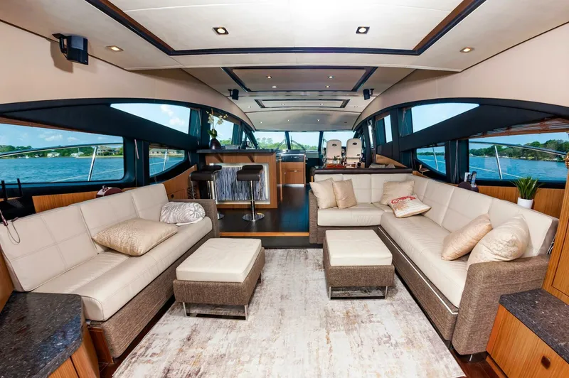 Slide: The Image of Luxurious interior of 2015 Sea Ray L659 Fly yacht with elegant seating and panoramic windows. - 26