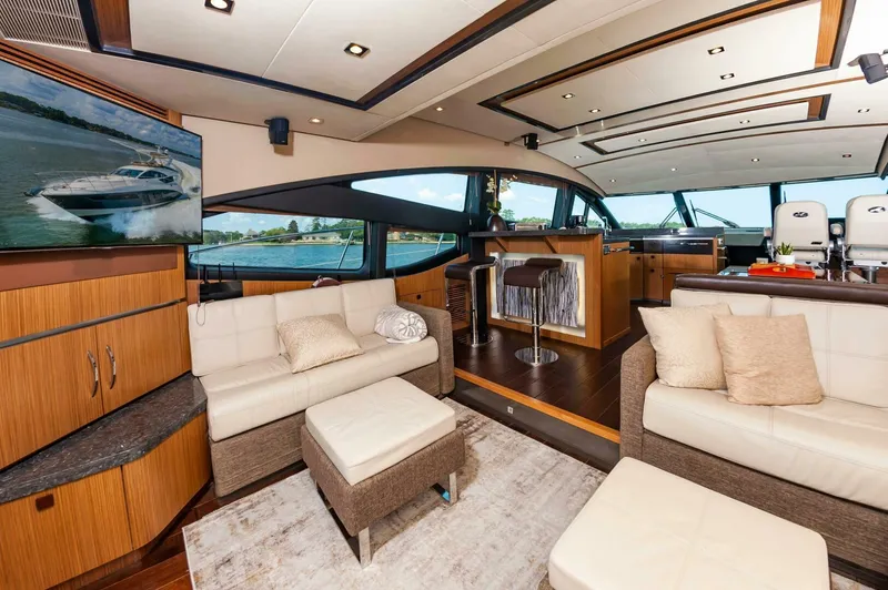 Slide: The Image of Luxurious interior of 2015 Sea Ray L659 Fly yacht with modern furnishings and panoramic windows. - 27