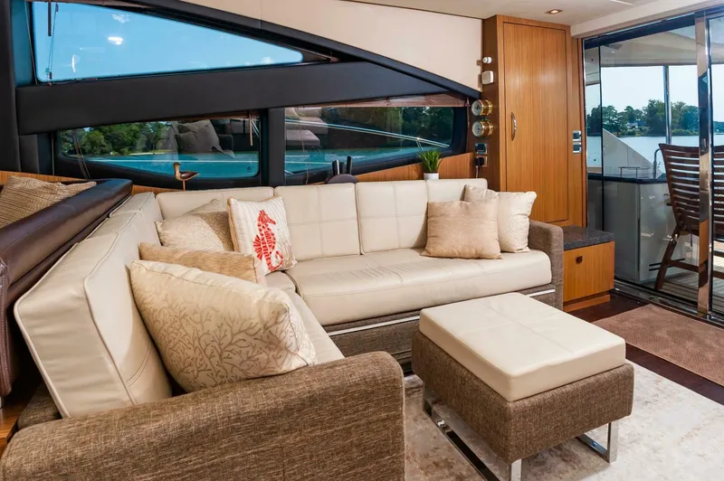 Slide: The Image of Luxurious interior of 2015 Sea Ray L659 Fly yacht with elegant seating and scenic views. - 28