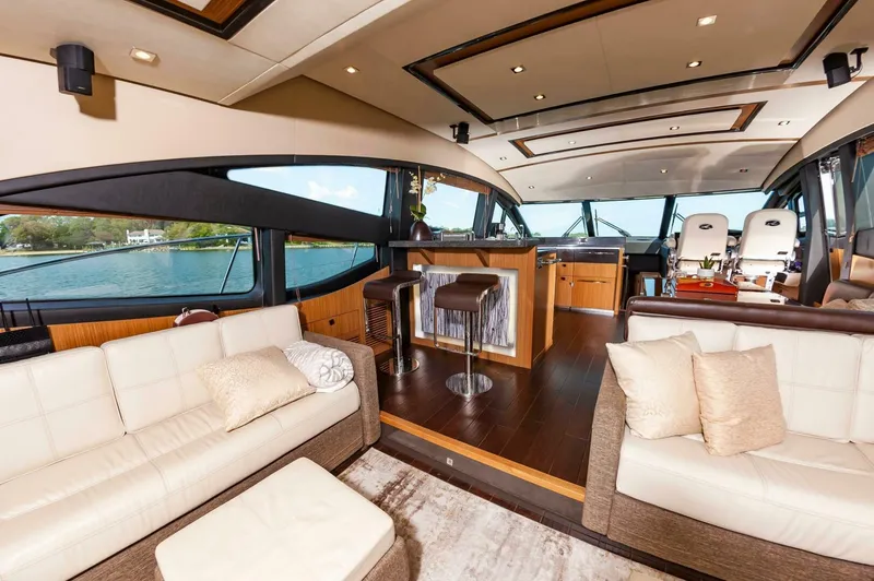 Slide: The Image of Luxurious interior of 2015 Sea Ray L659 Fly yacht with elegant seating and panoramic windows. - 29