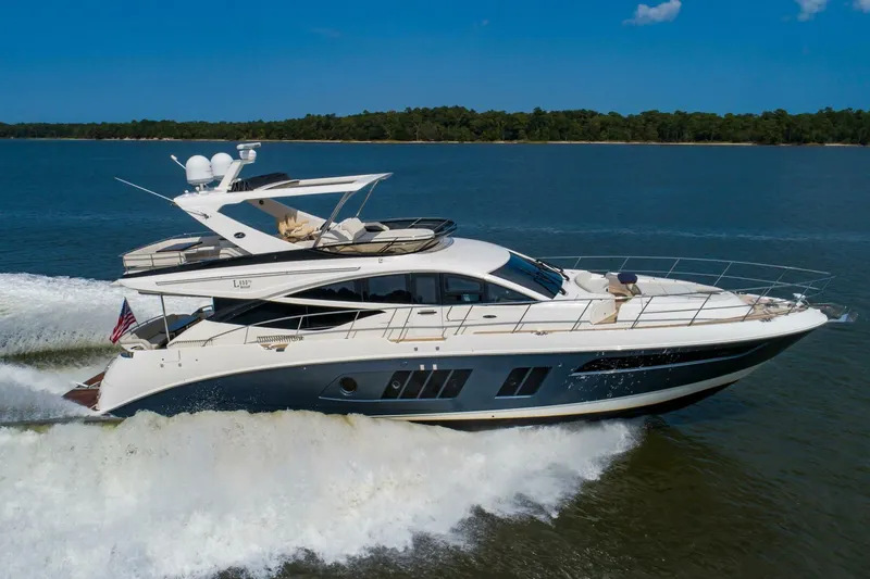 Slide: The Image of 2015 Sea Ray L659 Fly yacht cruising on open water. - 3