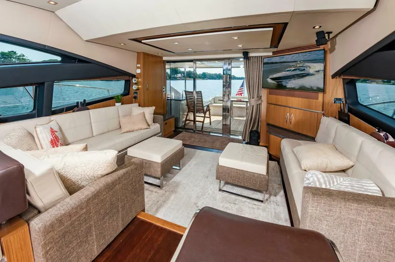 Slide: The Image of Luxurious interior of 2015 Sea Ray L659 Fly yacht with elegant seating and lake view. - 31