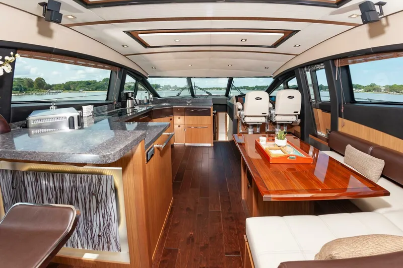 Slide: The Image of Luxurious interior of 2015 Sea Ray L659 Fly yacht with modern kitchen and seating area. - 32