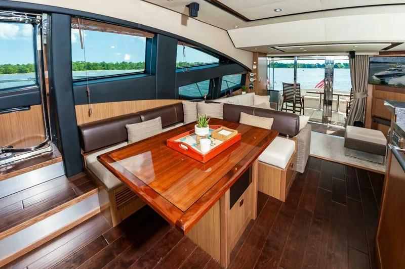 Slide: The Image of Luxurious interior of 2015 Sea Ray L659 Fly yacht with elegant dining area and lake view. - 36
