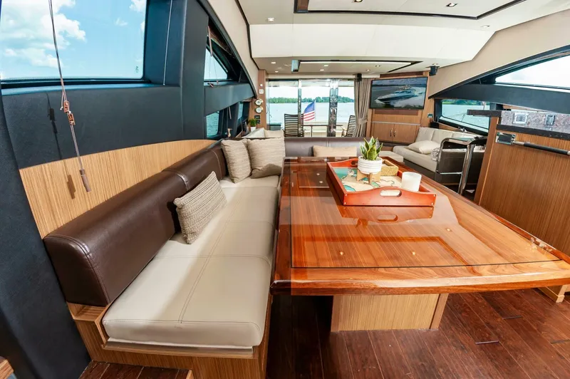 Slide: The Image of Luxurious interior of 2015 Sea Ray L659 Fly yacht with elegant seating and wooden table. - 37