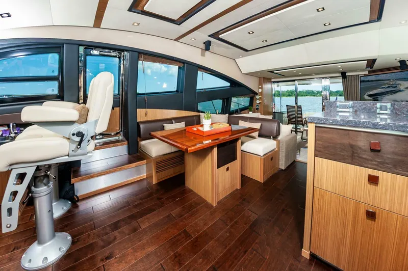 Slide: The Image of Luxurious interior of 2015 Sea Ray L659 Fly yacht with elegant wood finishes and modern seating. - 39
