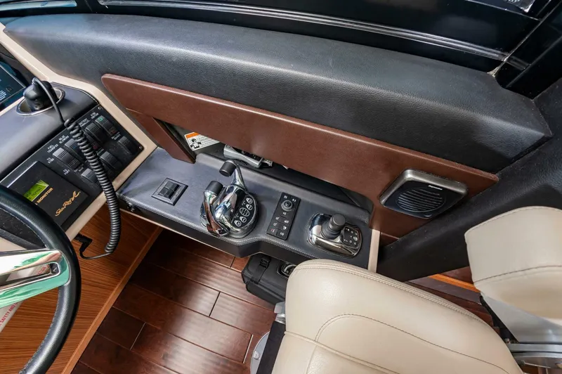Slide: The Image of 2015 Sea Ray L659 Fly helm controls with joystick and leather accents. - 41